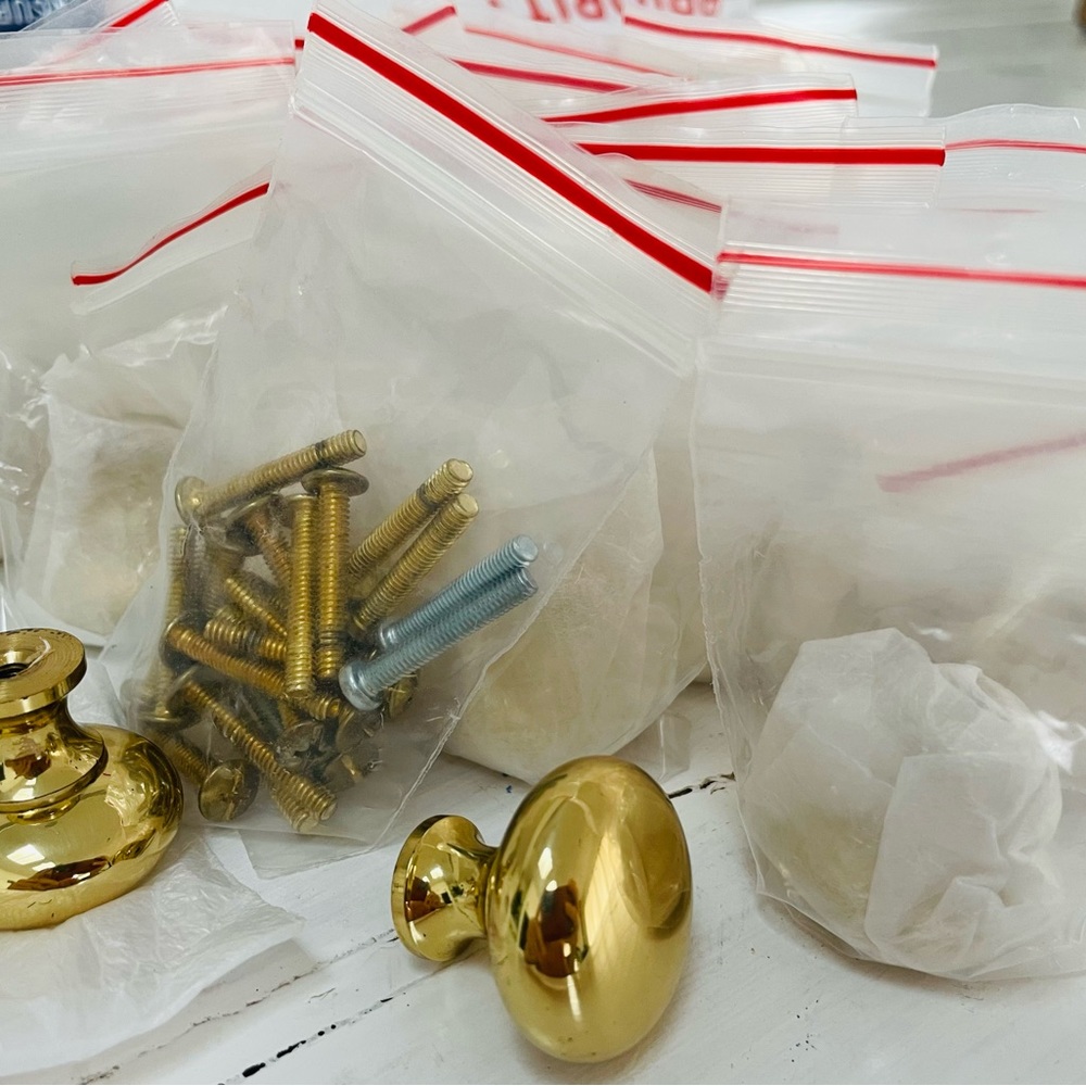 Polished brass cabinet knobs x 27
